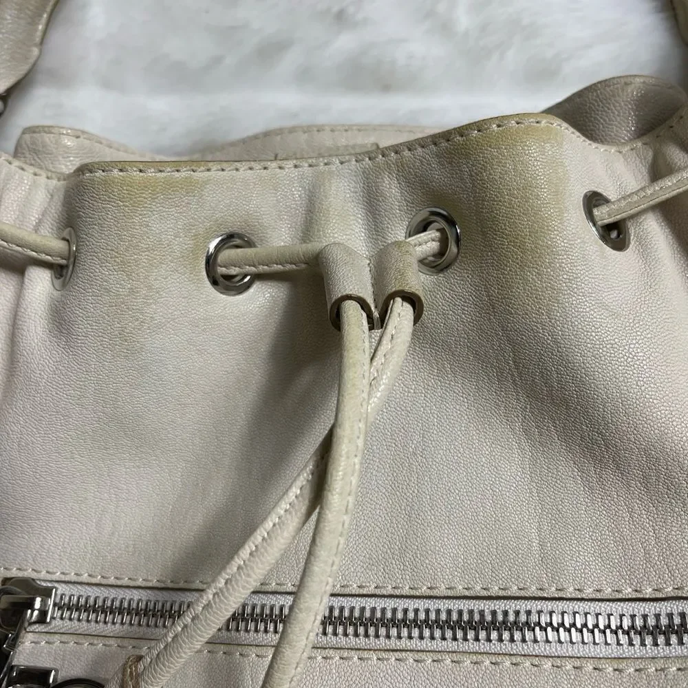 Michael Michael Kors leather beige drawstring bucket satchel.silver tone accents